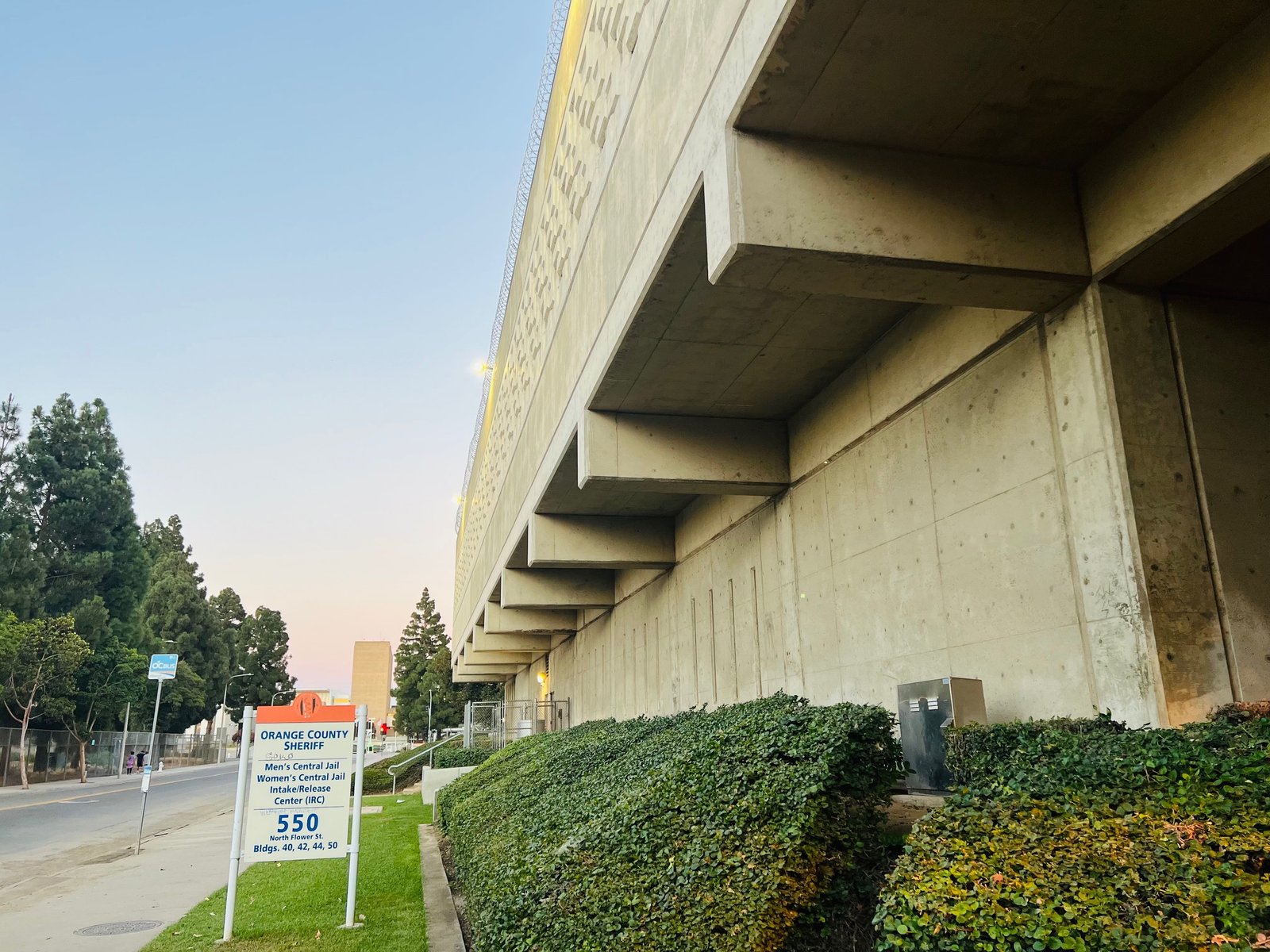 Side exterior of the Orange County jail complex beside the North Flower Street jail sign